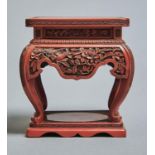 A CHINESE CINNABAR LACQUER STAND, EARLY 20TH C, THE APRON CARVED WITH BIRDS AND FLOWERS, ON