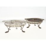 A PAIR OF EDWARDIAN SAW PIERCED SILVER SWEETMEAT STANDS, OF COMPRESSED FORM WITH GADROONED RIM ON