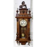 A LATE VICTORIAN WALNUT VIENNA WALL CLOCK, C1890, THE ORNATE PEDIMENT WITH HORSE FINIAL, MASK AND