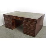 A MAHOGANY PEDESTAL DESK, MID 20TH C, WITH GREEN LEATHER INLET WRITING SURFACE AND FITTED NINE