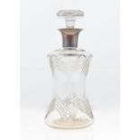 A GEORGE V SILVER MOUNTED CUT GLASS DECANTER AND MUSHROOM STOPPER, THE DECANTER OF WAISTED FORM WITH