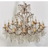 AN EIGHTEEN LIGHT AND GILTMETAL CHANDELIER IN LATE 18TH C STYLE, IN TWO TIERS WITH CENTRAL OBELISK