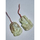 TWO CHINESE CELADON AND MOTTLED RUSSET JADE PENDANTS, 20TH C, ONE CARVED WITH A SAGE AND MONKEY,