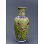 A CHINESE LIME GREEN GROUND FAMILLE ROSE VASE, 19TH C, OF GENTLY TAPERED SHOULDERED FORM WITH