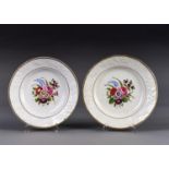 A PAIR OF ENGLISH PORCELAIN FLORAL MOULDED DESSERT PLATES, C1820, PAINTED WITH A CENTRAL GROUP OF