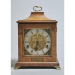A FIGURED WALNUT MANTEL CLOCK, 1930'S, IN 17TH C ENGLISH STYLE, WITH ENGRAVED BRASS DIAL AND MASK