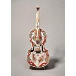 A DUTCH DELFT DORE MODEL OF A VIOLIN, LATE 19TH C, DECORATED WITH CHINOISERIES AND FLOWERS, 59CM L