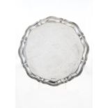 A GEORGE VI SILVER SALVER, ON FOUR LEAF CAPPED VOLUTE FEET, 36CM DIAM, BY VINERS LTD, SHEFFIELD