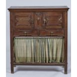 A JACOBEAN REVIVAL OAK CUPBOARD, C1920, THE RECTANGULAR TOP ABOVE A PAIR OF CUPBOARDS WITH APPLIED