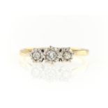 A THREE STONE DIAMOND RING, ILLUSION SET, IN GOLD MARKED 18CT, 2.8G, SIZE Q Condition reportTiny