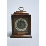 A WALNUT MANTEL TIMEPIECE IN THE FORM OF A 17TH C ENGLISH BASKET TOPPED TABLE CLOCK, SECOND