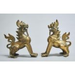 A PAIR OF SOUTH EAST ASIAN BRASS AND GREEN GLASS DECORATED SCULPTURES OF DRAGONS,  EARLY 20TH C,