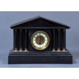 A BLACK SLATE MANTEL CLOCK, C1870, ARCHITECTURAL PEDIMENT ABOVE AN ENGRAVED FRIEZE, THE DIAL WITH