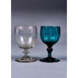 AN ENGLISH FLUTED GREEN GLASS GOBLET AND AN ENGRAVED GLASS RUMMER, BOTH C1820-30, THE RUMMER