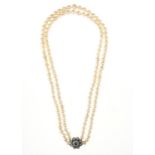 A CULTURED PEARL TWO ROW NECKLACE WITH SAPPHIRE AND DIAMOND CLASP, 59CM L, CLASP 21MM DIAM, 108G