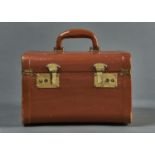 VINTAGE LUGGAGE. A STITCHED TAN HIDE COVERED WOOD VANITY CASE, MID 20TH C, THE INTERIOR LINED IN