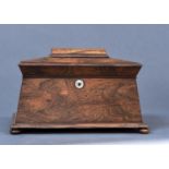 A POST REGENCY ROSEWOOD VENEERED SARCOPHAGUS SHAPED TEA CADDY, C1830, THE TOP WITH DOMED PANEL,