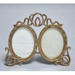 A FIN DE SIECLE BRASS DOUBLE PHOTOGRAPH FRAME, C1900, WITH WIREWORK CRESTING, FEET AND STRUTT,