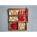 TWO VICTORIAN BONE CHESS SETS, 19TH C, OF BARLEYCORN TYPE, STAINED RED AND NATURAL, KINGS 10CM H (