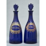 A PAIR OF ENGLISH COBALT BLUE GLASS DECANTERS AND STOPPERS, C1800, WITH NEO CLASSICAL STYLE GILT