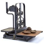 A PAIR OF VICTORIAN CAST IRON PLATFORM SCALES TO WEIGH 20 LBS, THE RECTANGULAR BASE WITH RISING CAST