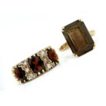 A GARNET RING AND A CITRINE RING, BOTH IN 9CT GOLD, 9G SIZES, L½ AND Q GOOD CONDITION