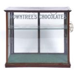 ROWNTREE'S CHOCOLATES - A MAHOGANY FRAMED GLASS DISPLAY CASE, REVERSE DECORATED WITH ROWNTREE'S