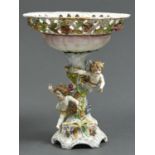A POTSCHAPPEL FLORAL ENCRUSTED CENTREPIECE, C1900, THE SHELL SHAPED BOWL WITH TRELLIS BORDER ON