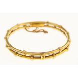 A GOLD BAMBOO FORM BANGLE, EARLY 20TH C, 64MM, MARKED 18CT, 14G Good condition