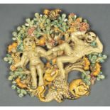 STUDIO POTTERY. A POLYCHROME GLAZED TERRACOTTA ADAM AND EVE WALL PLAQUE BY CATHERINE ROOKE, WITH