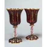 A PAIR OF RUBY STAINED GLASS GOBLETS, PROBABLY FRENCH, MID 19TH C, THE LOBED GILT BELL SHAPED BOWL