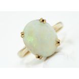 AN OPAL RING, THE CABOCHON 11 X 13MM,  IN 9CT GOLD,  EDINBOROUGH 1978,  4G,  SIZE O Opal of good