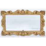A VICTORIAN GILTWOOD MIRROR, KENTIAN STYLE, 19TH C, THE FRAME CARVED WITH C AND S SCROLLS CENTRED BY