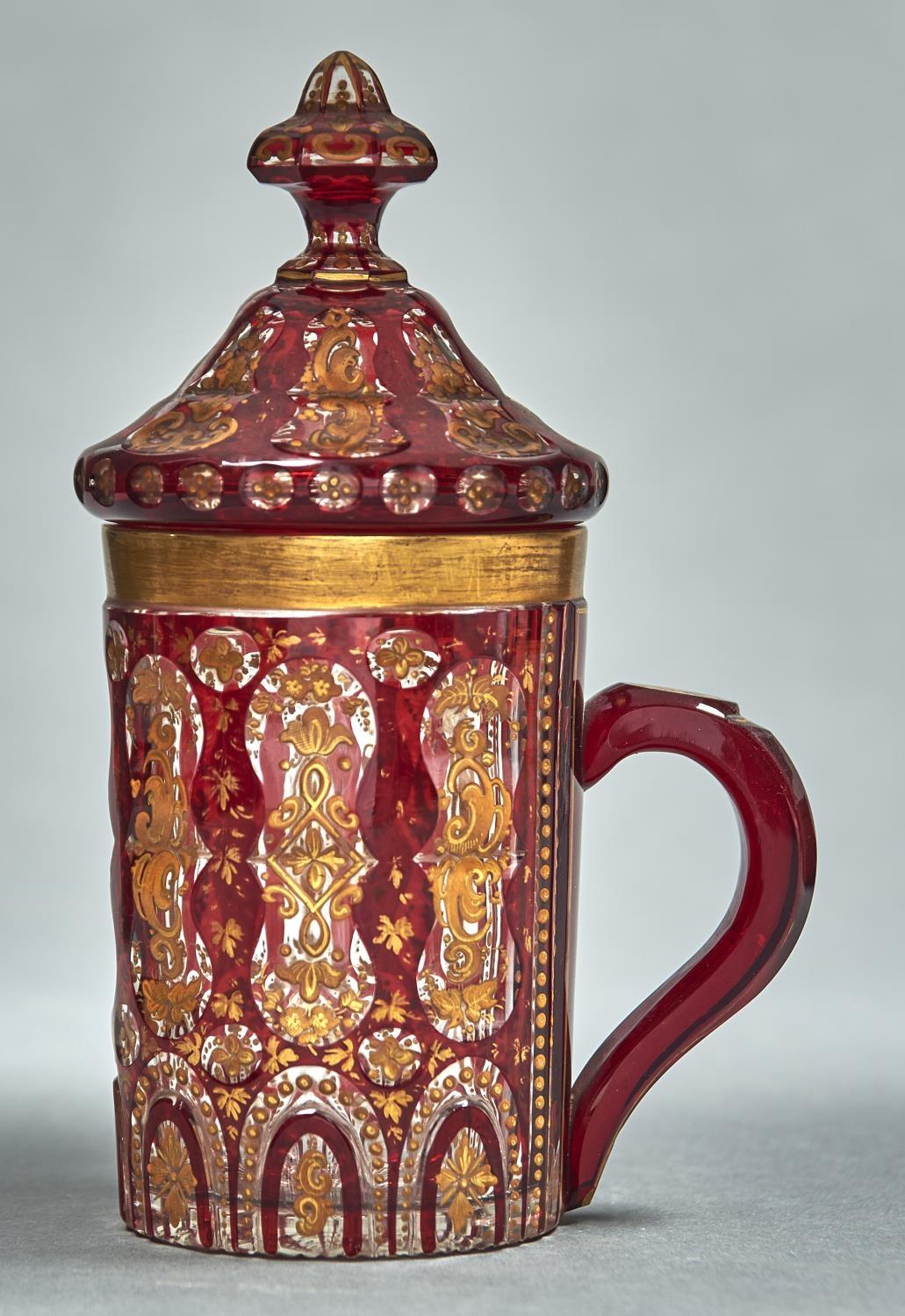 A BOHEMIAN RUBY FLASHED AND ENAMELLED GLASS MUG AND COVER, POSSIBLY MADE FOR THE OTTOMAN MARKET,