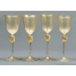 A SET OF FOUR VENETIAN GOLD LEAF GLASS  GOBLETS, EARLY 20TH C, THE BELL SHAPED BOWL ON WRYTHEN