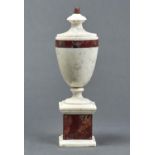 A MARBLE URN, 20TH C, IN NEO CLASSICAL STYLE, OF SHIELD SHAPE WITH BAND OF RED BRECCIA MARBLE AND