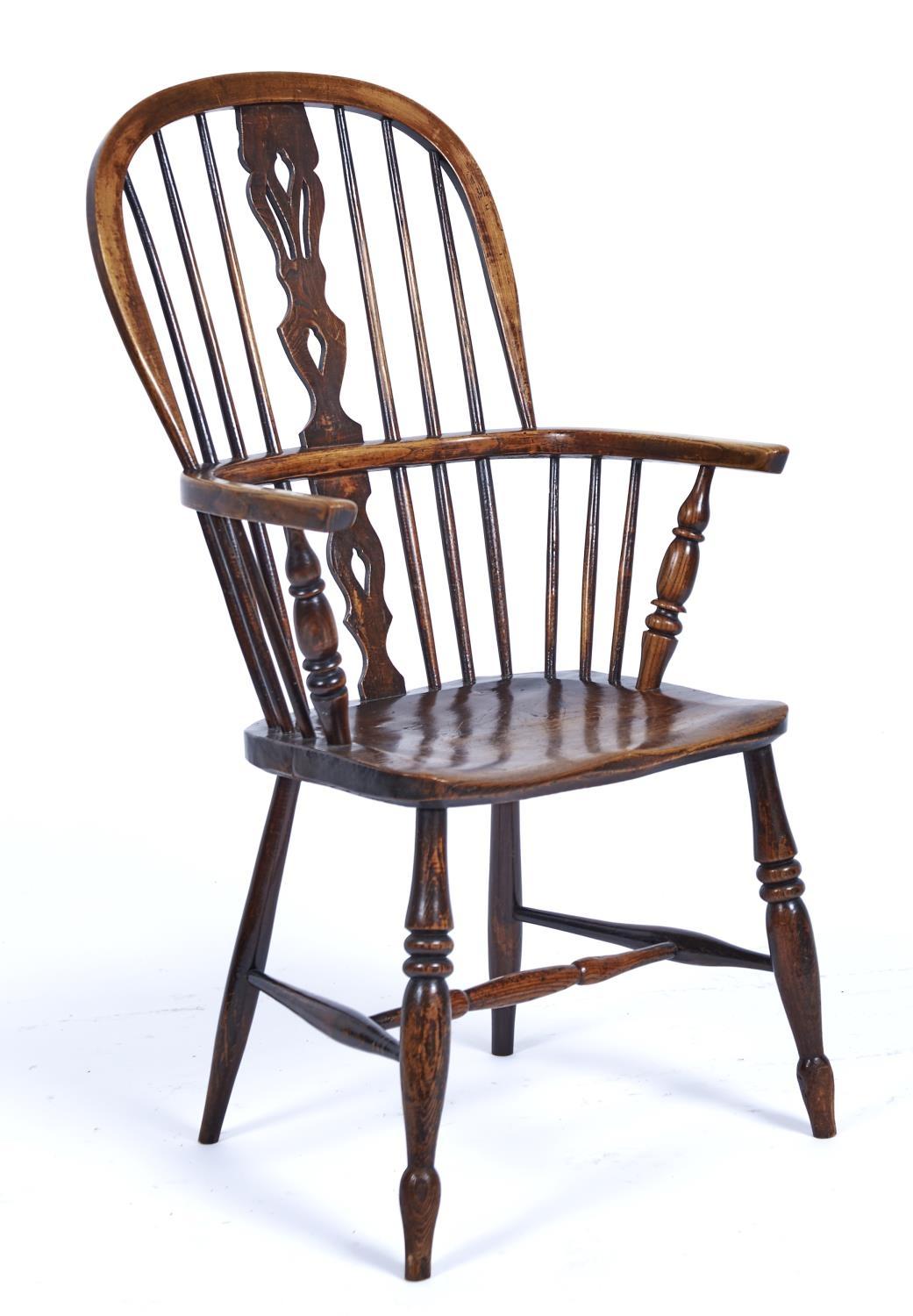 A WINDSOR HIGH BACK ELBOW CHAIR, C1870, THE PIERCED SPLAT FLANKED BY SPINDLES, DISHED BOARDED ELM