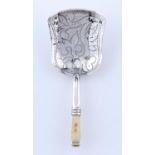 A VICTORIAN SILVER CADDY SPOON WITH WRIGGLEWORK TO THE BOWL, TURNED BONE HANDLE, 85MM L, MAKER'S