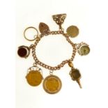 A GOLD CHARM BRACELET, THE 9CT GOLD CURB BRACELET HUNG WITH A COLLECTION OF CHARMS, INCLUDING