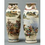 A PAIR OF JAPANESE SATSUMA VASES, MEIJI PERIOD, ENAMELLED WITH SAMURAI IN A CONTINUOUS LANDSCAPE,
