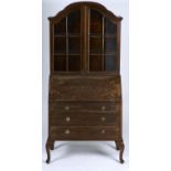 A REPRODUCTION MAHOGANY BUREAU BOOKCASE IN QUEEN ANNE STYLE, C1930, THE CONCAVE MOULDED SHAPED