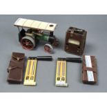 A MAMOD TRACTION ENGINE, VOLTAGE TESTER, TEMPERATURE TOOLS AND SLIDE RULE