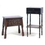 A CHINESE BLACK LACQUER WO TIER WORK TABLE, THE HINGED LID AND UNDER TIER WITH TRANSFER PRINTED