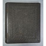 A CARVED EBONY BLOTTING BOOK, 19TH C,  WITH TENDRILS WITHIN CONFORMING FOLIATE PALMETTE BORDERS,