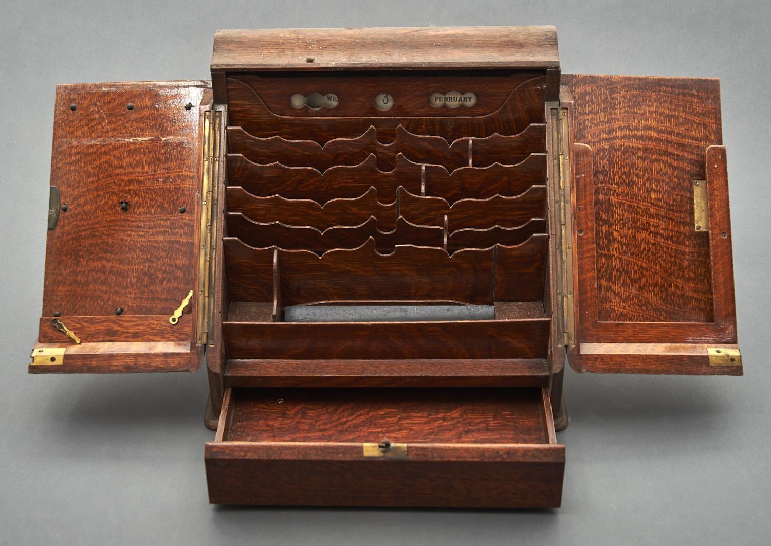 A VICTORIAN OAK SLOPE FRONT STATIONERY BOX, THE HINGED OGEE TOP AND PAIR OF DOORS OPENING TO - Image 2 of 2