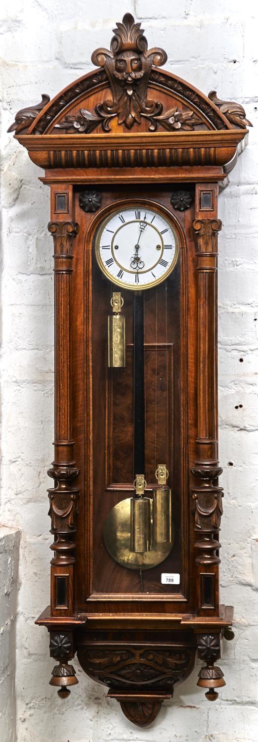 A WALNUT TRIPLE WEIGHT VIENNA WALL CLOCK, LATE 19TH C, WITH ENAMEL DIAL AND PIERCED HANDS, FIGURED