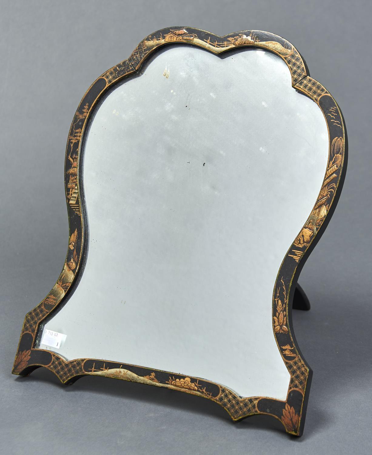 A BLACK JAPANNED STRUT MIRROR OF DOUBLE ARCHED WAISTED FORM,  DECORATED IN CHINOISERIE STYLE WITH