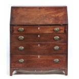 A GEORGE III MAHOGANY FALL-FRONT BUREAU, C1800, INLAID WITH A SHADED SHELL PATERA ON HAREWOOD GROUND