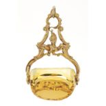 A GOLD AND CITRINE SWIVEL FOB SEAL, IN ROCOCO STYLE, 47MM H EXCLUDING LOOP, UNMARKED, 22.8G Good