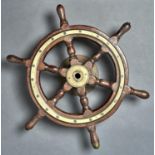 MARITIME ANTIQUES.  A VICTORIAN TEAK AND BRASS YACHT'S WHEEL, 51.5CM ACROSS HANDLES Showing signs of